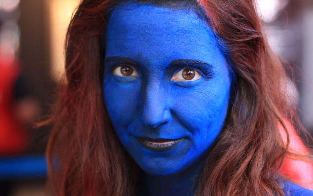 Blue painted woman cosplaying Mystique